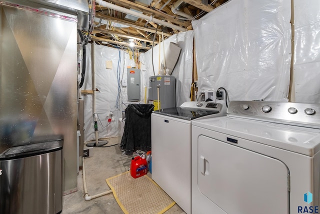 washroom with electric panel, electric water heater, heating unit, and independent washer and dryer