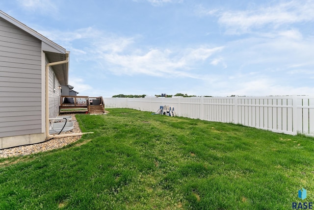 view of yard with a wooden deck