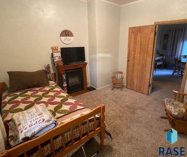 carpeted bedroom with crown molding