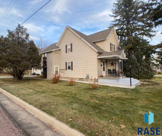 view of property exterior with a lawn and covered porch