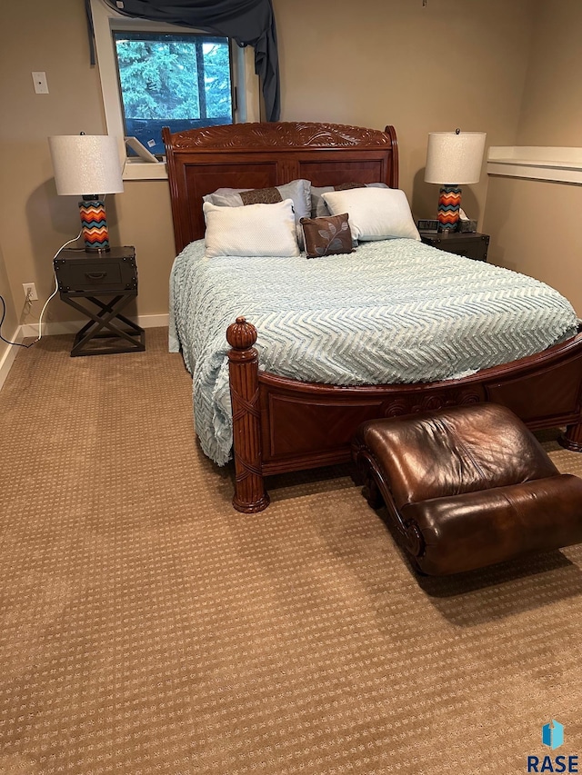 bedroom featuring light colored carpet