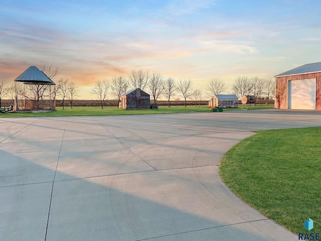 surrounding community with a lawn and an outdoor structure