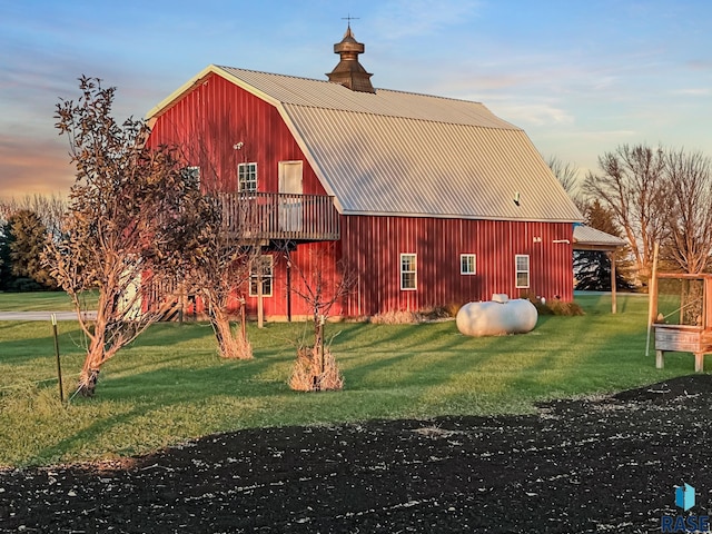 exterior space with an outbuilding and a yard