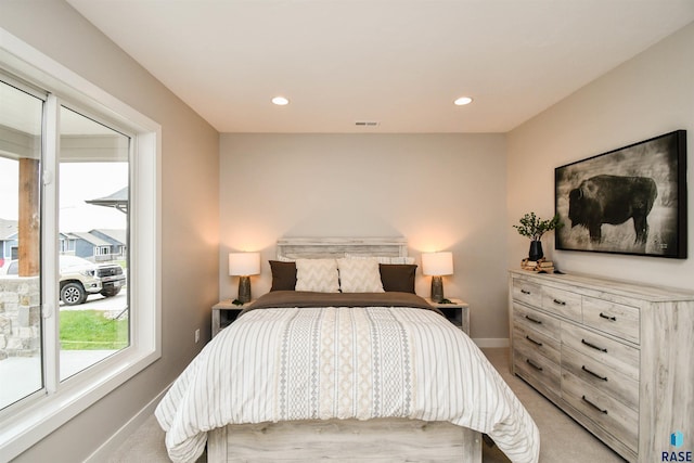 bedroom featuring light colored carpet