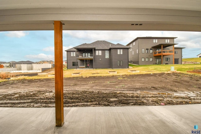 view of yard featuring a balcony