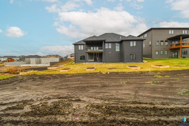 rear view of property with a balcony