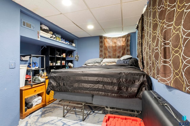 bedroom featuring a paneled ceiling