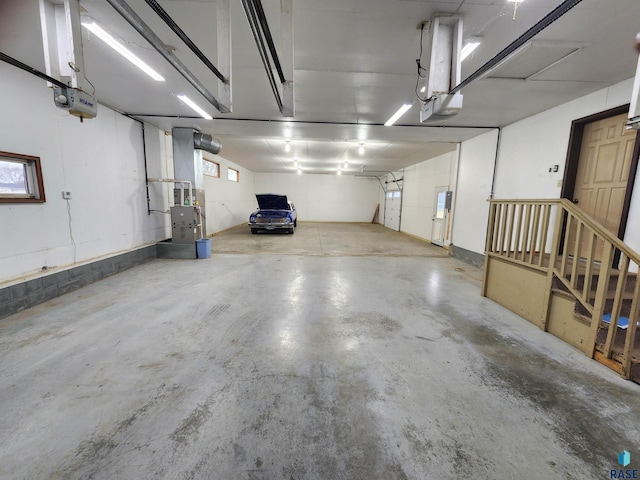 garage with heating unit and a garage door opener