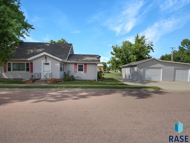 single story home with a front yard and a garage