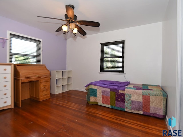 bedroom featuring ceiling fan and dark hardwood / wood-style floors