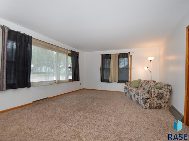 unfurnished room featuring carpet floors