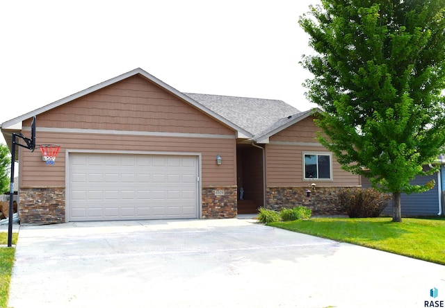 view of front facade with a front yard and a garage