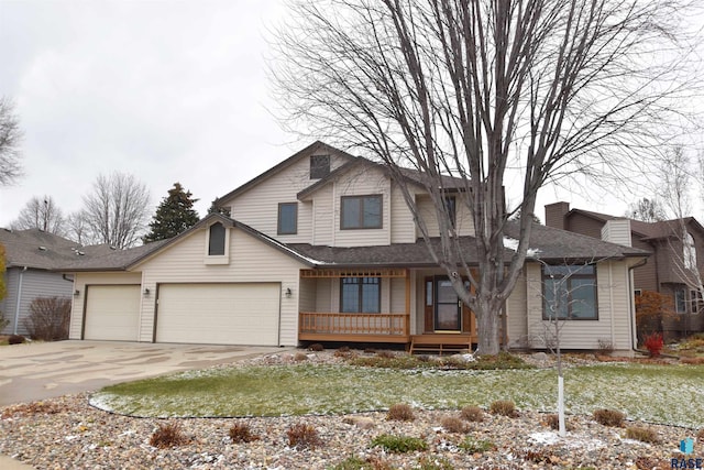 view of front of property featuring a porch and a garage