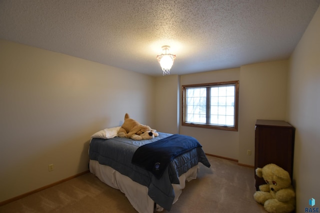 carpeted bedroom with a textured ceiling