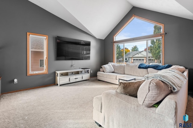 carpeted living room featuring vaulted ceiling