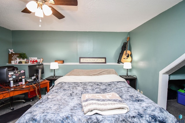 bedroom featuring carpet flooring, ceiling fan, and a textured ceiling