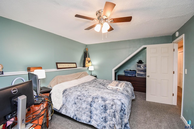 carpeted bedroom featuring a textured ceiling and ceiling fan