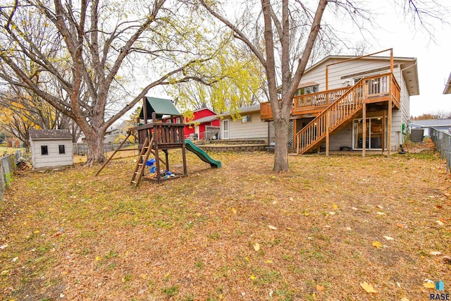 view of yard with a shed, a playground, and central air condition unit