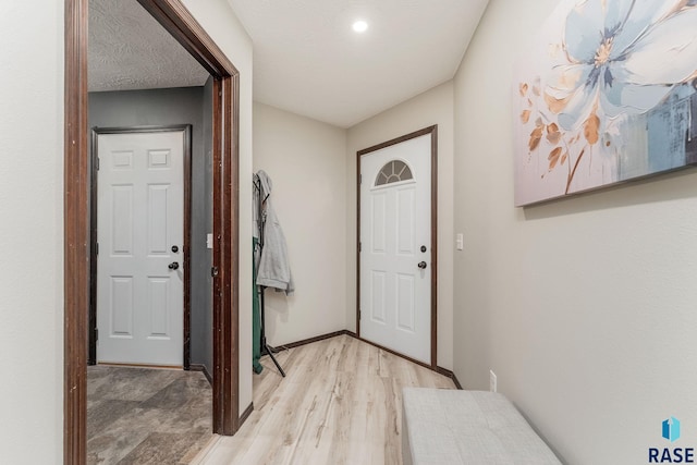 doorway to outside with light hardwood / wood-style flooring