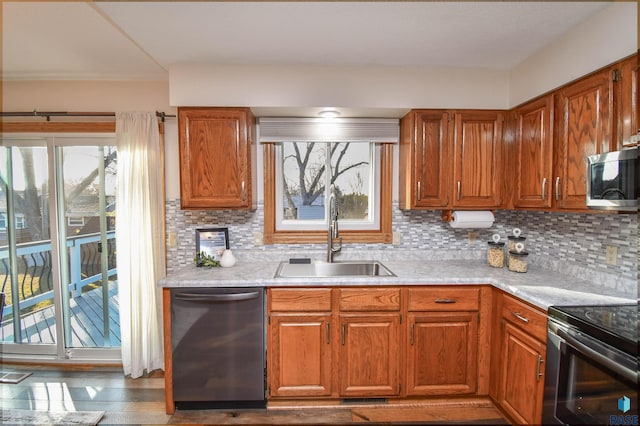 kitchen featuring tasteful backsplash, sink, and appliances with stainless steel finishes