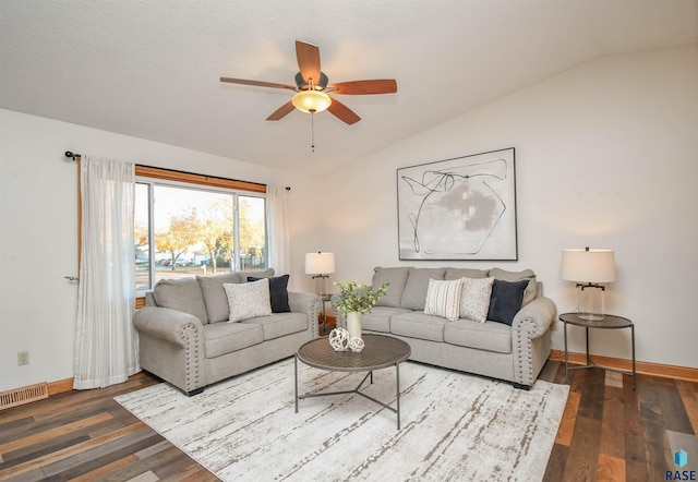 living room with hardwood / wood-style floors, a textured ceiling, vaulted ceiling, and ceiling fan