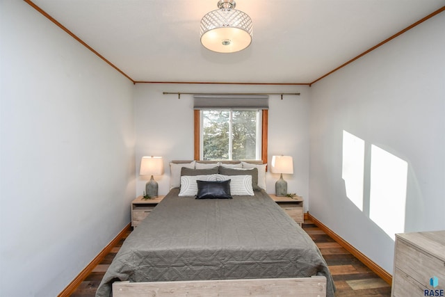 bedroom with dark hardwood / wood-style flooring and ornamental molding