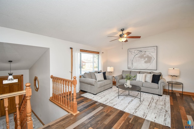 living room featuring hardwood / wood-style flooring, ceiling fan, a textured ceiling, and vaulted ceiling