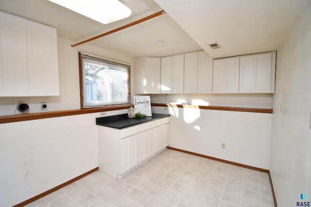 kitchen with white cabinets