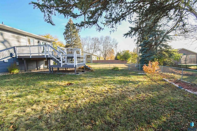 view of yard with a wooden deck