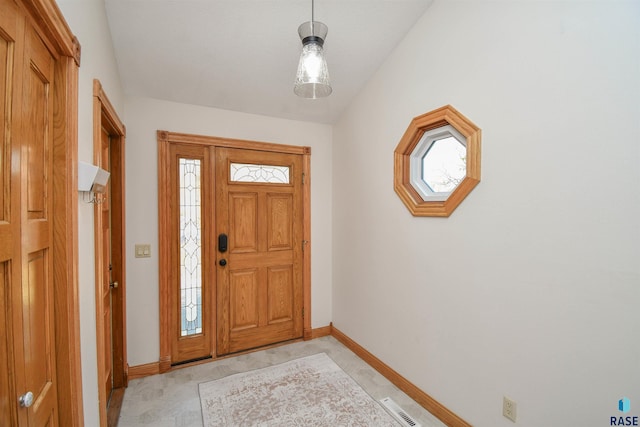 entrance foyer featuring vaulted ceiling and plenty of natural light