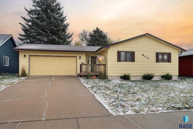 ranch-style home featuring a garage