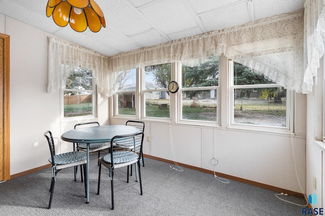 sunroom / solarium featuring a drop ceiling