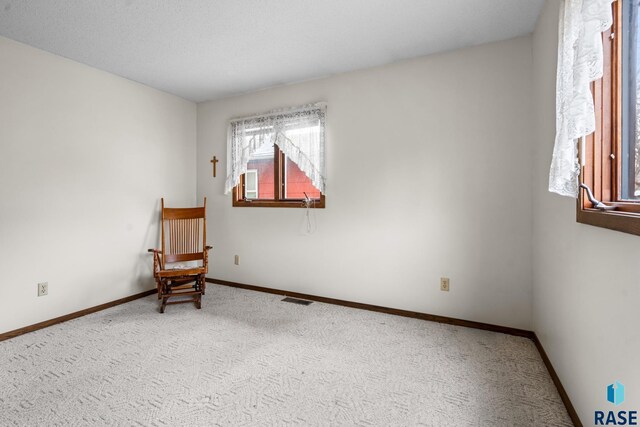 living area featuring carpet