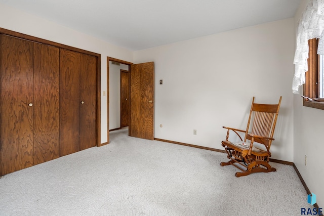 unfurnished room featuring light colored carpet