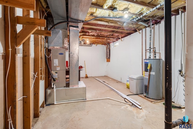 basement featuring heating unit, water heater, and electric panel