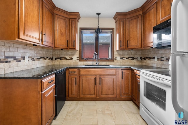 kitchen featuring black appliances, sink, light tile patterned floors, tasteful backsplash, and decorative light fixtures