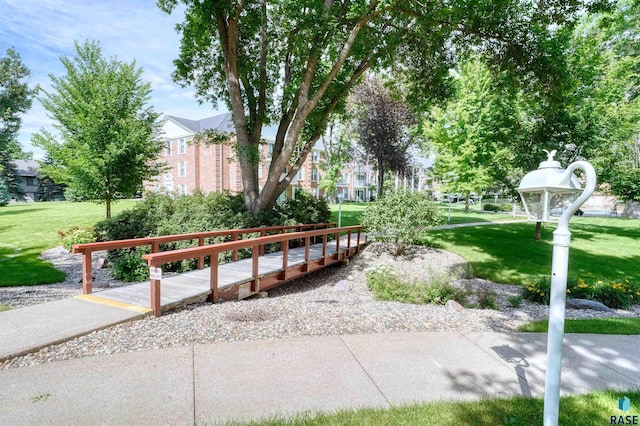 view of home's community featuring a lawn