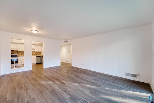 unfurnished living room featuring light hardwood / wood-style flooring