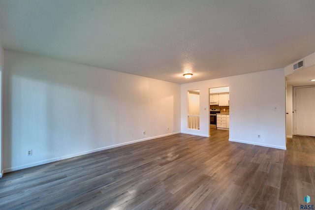 empty room featuring dark hardwood / wood-style floors