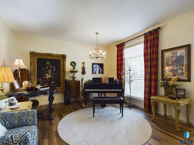 miscellaneous room featuring dark hardwood / wood-style floors and an inviting chandelier