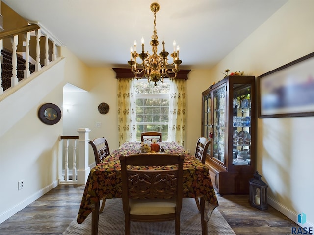 dining room featuring dark hardwood / wood-style flooring and a notable chandelier