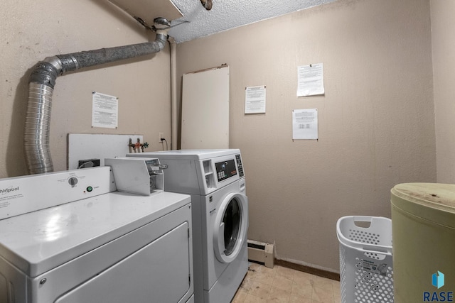 laundry room with separate washer and dryer, a textured ceiling, and a baseboard radiator