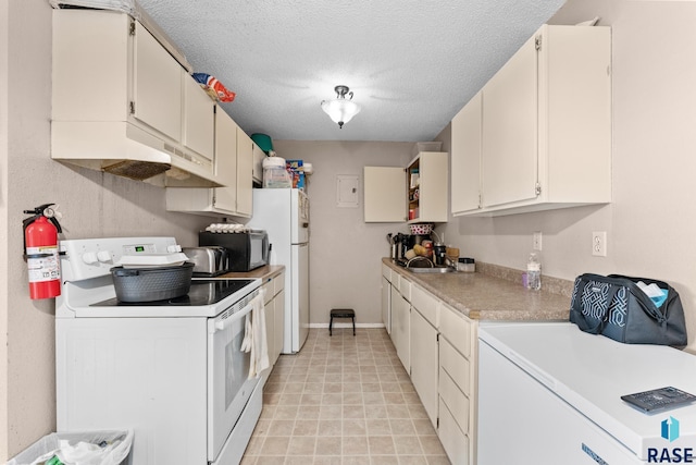 kitchen with a textured ceiling, sink, white cabinets, and white appliances