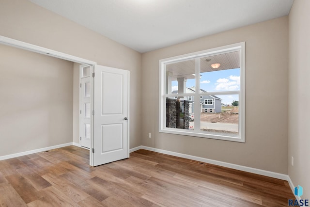 unfurnished bedroom featuring light hardwood / wood-style floors