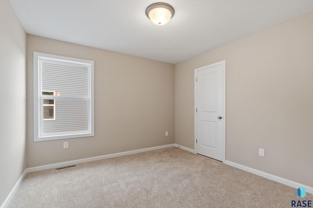 view of carpeted spare room