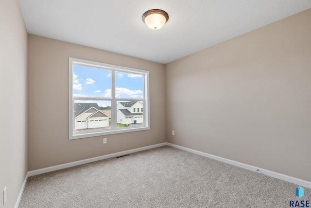 empty room with carpet flooring