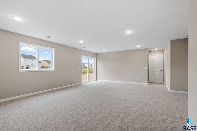 empty room with light colored carpet