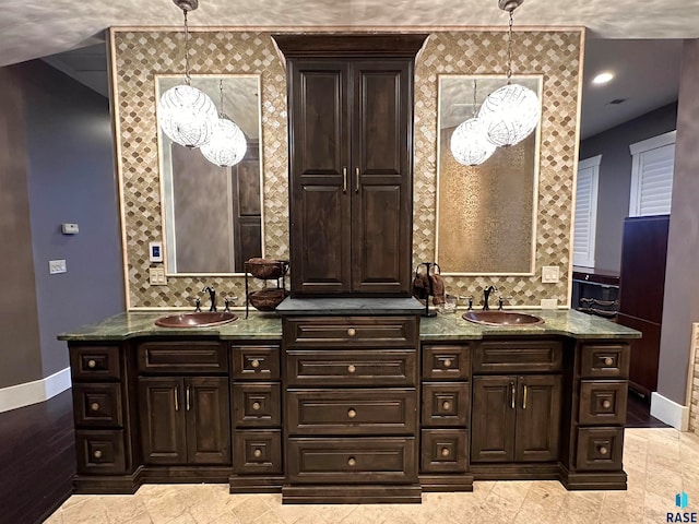 bathroom with vanity and decorative backsplash