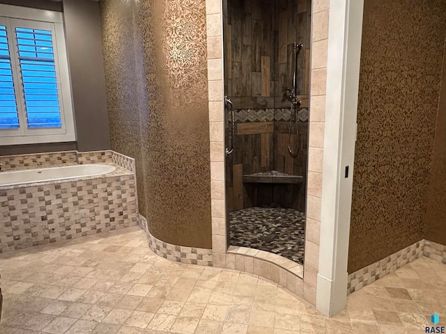 bathroom with independent shower and bath