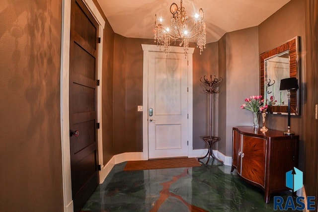 entryway with an inviting chandelier and lofted ceiling